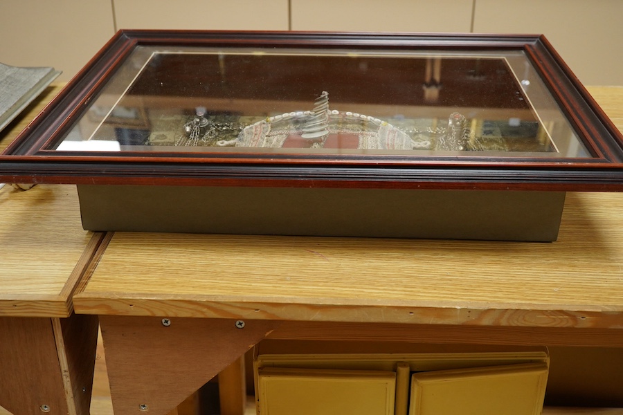 A framed Omani tribe wedding veil, 45 x 62cm. Condition - good